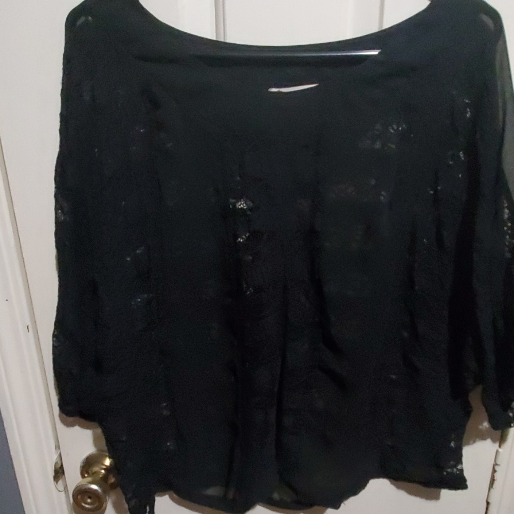 Black lace over blouse